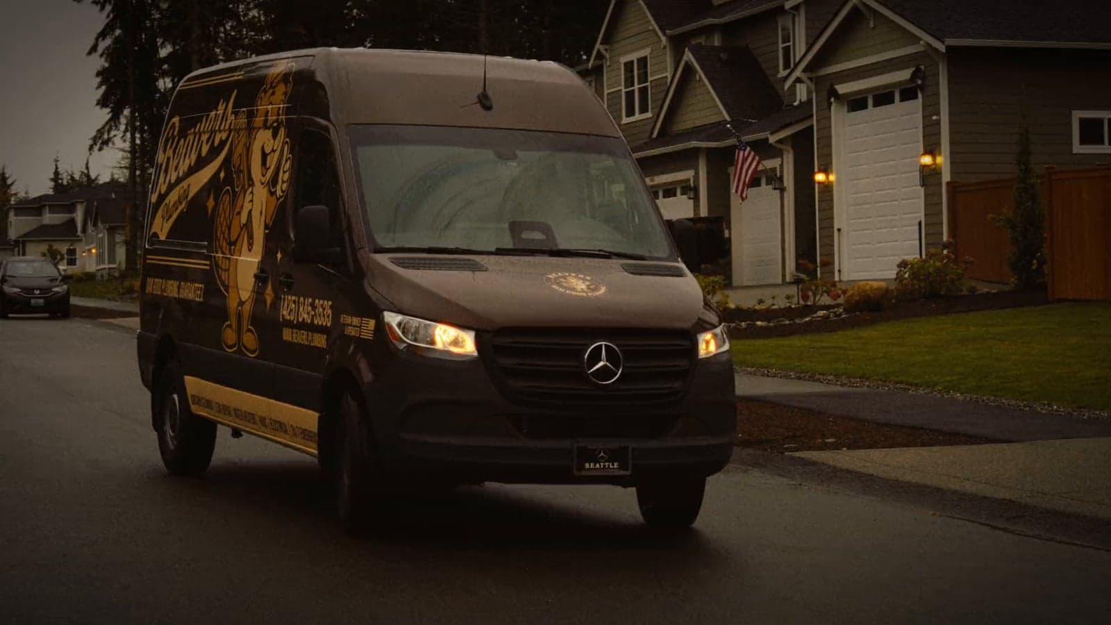 A Beaver's Plumbing service van pulling up to a house on a Pacific Northwest street